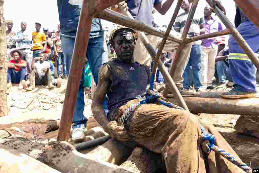 A miner gets ready to descend into a mining pit during a mine search and rescue operation at Cricket Mine in Kadoma, Mashonaland West Province, where more than 23 miners are trapped underground and feared dead.