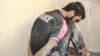 An Islamic State militant is detained in Mosul, Iraq, July 5, 2017. While many IS militants fought to the death in Mosul, some suspects were detained or surrendered during ongoing fighting. 