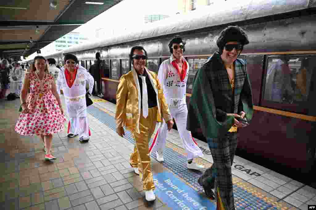 Elvis fans arrive at Central station before boarding a train to The Parkes Elvis Festival, in Sydney, Australia.