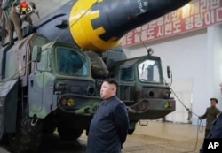 FILE - This image made from video of an undated still image broadcast by North Korea's KRT, May 15, 2017, shows leader Kim Jong Un at what was said to be a missile test site at an undisclosed location in North Korea.