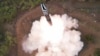 A view of a test launch of a new solid-fuel intercontinental ballistic missile (ICBM) Hwasong-18 at an undisclosed location in this still image of a photo used in a video released by North Korea's Korean Central News Agency (KCNA) April 14, 2023. 
