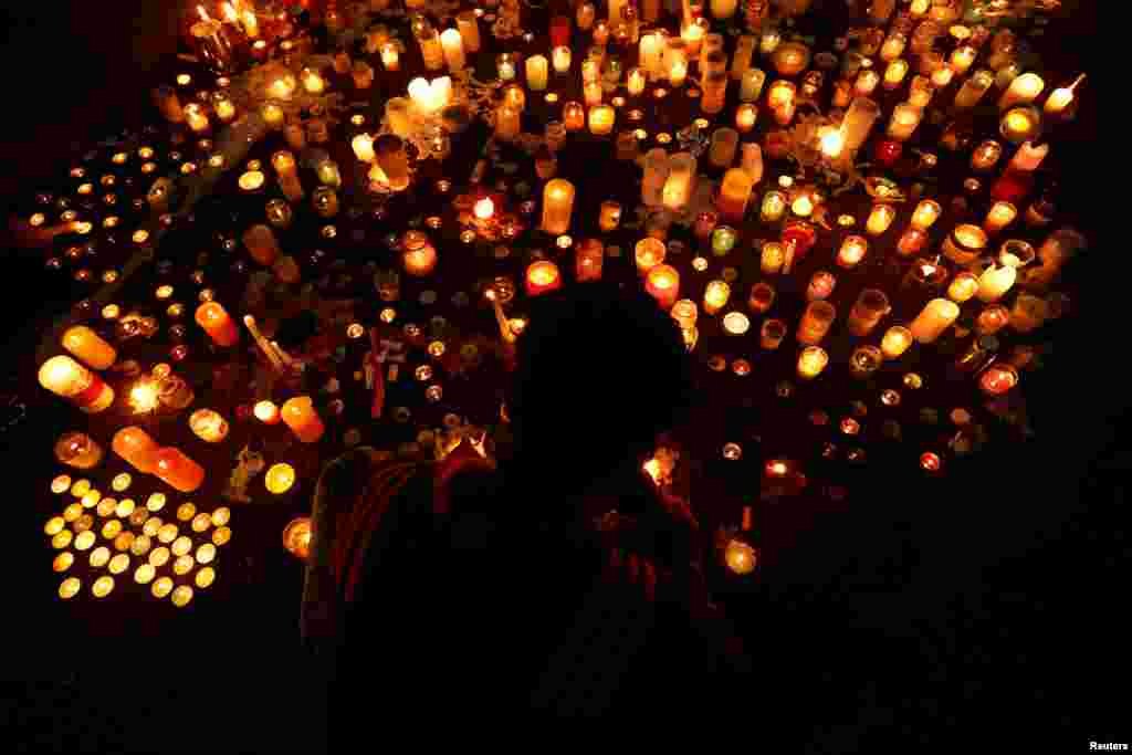 People visit a memorial site for victims of Friday's shooting, in front of the Masjid Al Noor mosque in Christchurch, New Zealand.