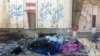 These bodies of IS militants were recently laid out in the street for pick-up under pro-Iraqi military graffiti on March 1, 2018 in Old Mosul, Iraq.