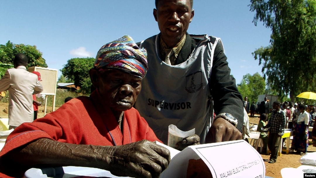 FILE - An elderly woman casts her vote in Malawi's general election in Machinga district, north of the commercial capital, Blantyre.