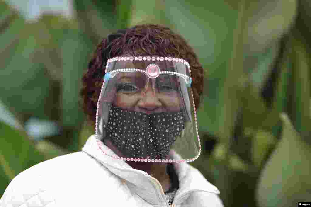 Rosa Russell, 70, wears a face shield decorated with jewels during the 2020 U.S. presidential election, in Santa Monica, California, Nov. 3, 2020.