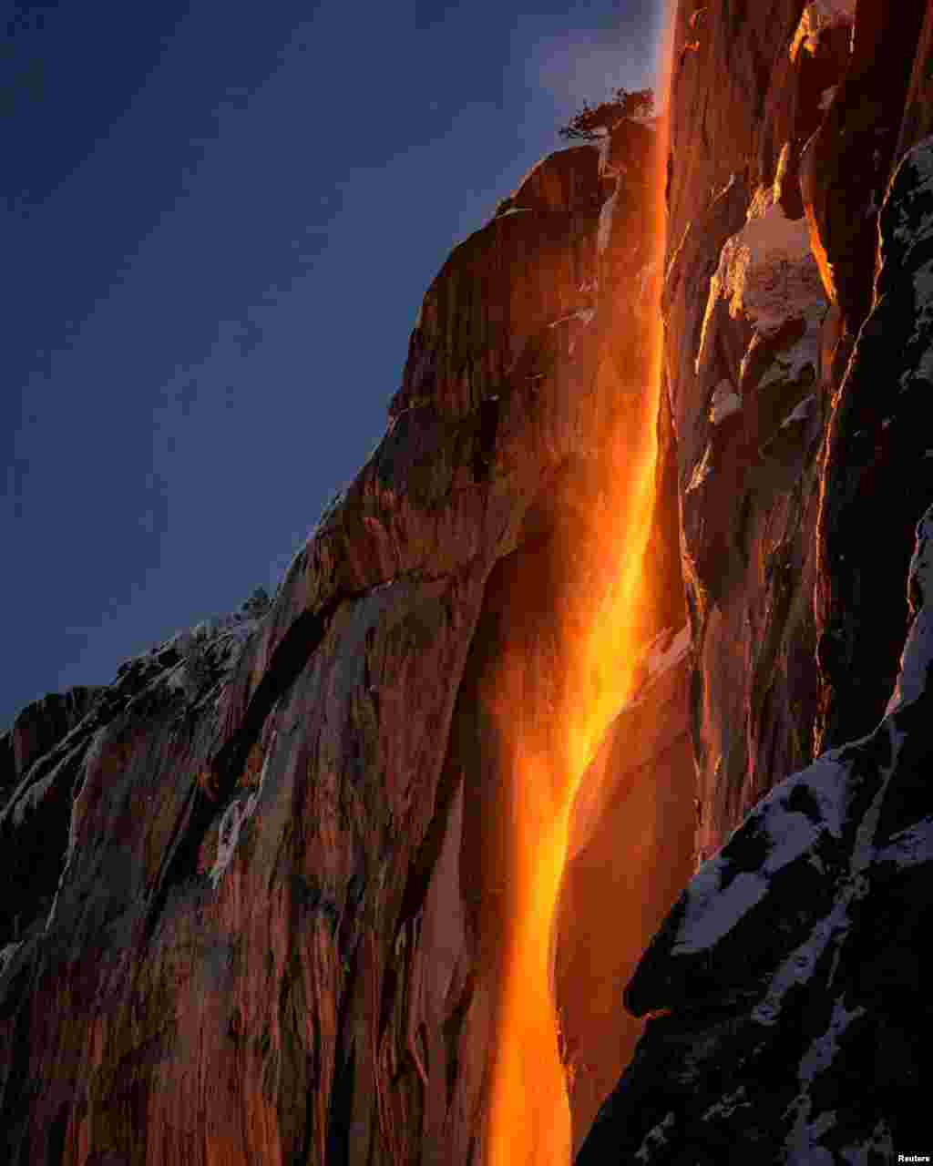 Sunlight hits the Horsetail Fall, turning it into a "Firefall", at Yosemite National Park, California, in this photo taken from social media.
