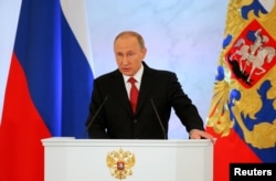 Russian President Vladimir Putin delivers a speech during his annual state of the nation address at the Kremlin in Moscow, Dec. 1, 2016.