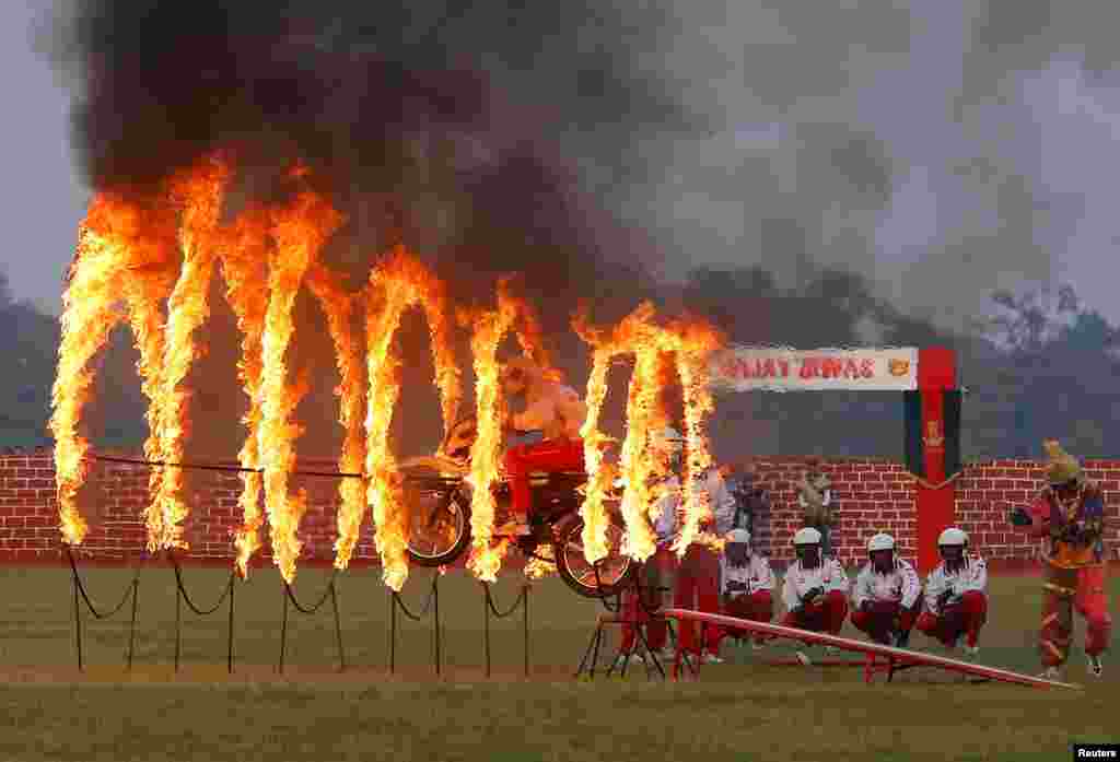 An Indian army soldier performs a stunt during celebrations ahead of the 'Vijay Diwas,' a ceremony to celebrate the Dec. 16, 1971 liberation of Bangladesh by the Indian Armed Forces, in Kolkata, India.