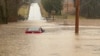 This photo provided by the Warren County, Ky., Sheriff's Office shows a partially submerged car outside of Bowling Green, Ky., on Feb. 15, 2025. 