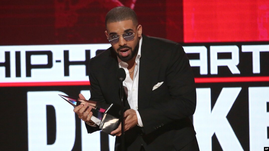 FILE - Drake accepts the award for favorite artist - rap/hip-hop at the American Music Awards at the Microsoft Theater in Los Angeles, Nov. 20, 2016. The rapper recorded more streams — more than 5.4 billion — than any other performer in 2016.