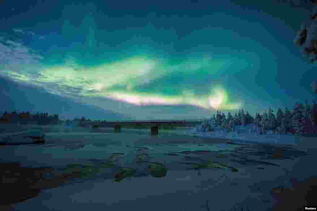 The Aurora Borealis (Northern Lights) is seen over the sky near Inari in Lapland, Finland.