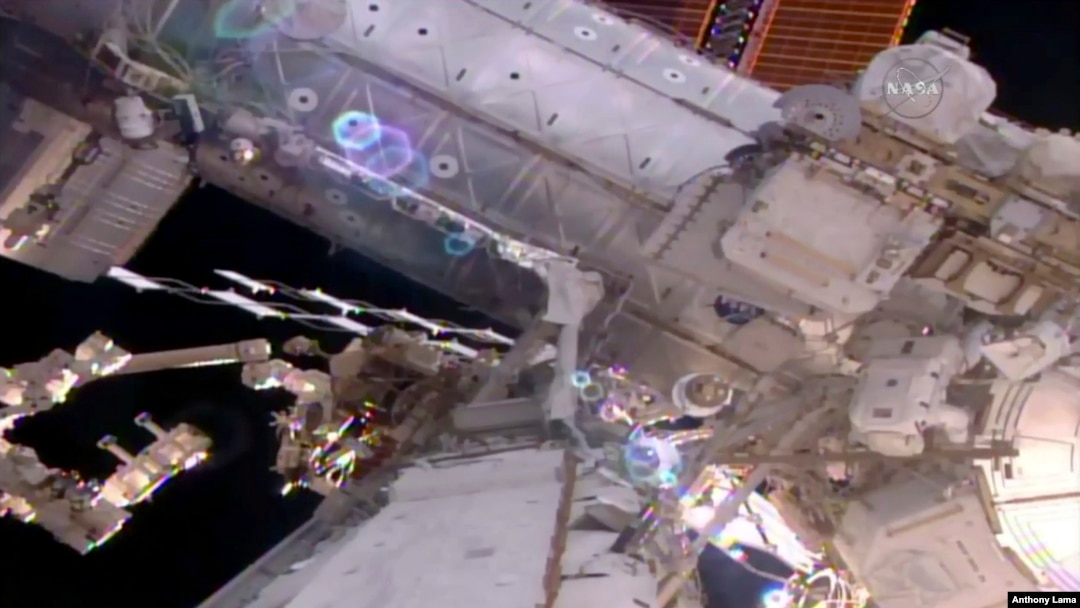 This still image taken from live video provided by NASA shows astronaut Shane Kimbrough, right, works on the International Space Station during a space walk March 24, 2017. 