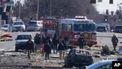 Investigators work the scene where a small plane crashed in Philadelphia, Pennsylvania, on Feb. 1, 2025.