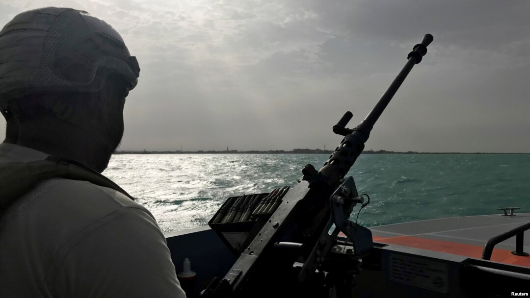 FILE - A UAE navy soldier patrols at Al-Mokha port in Yemen, March 6, 2018. 