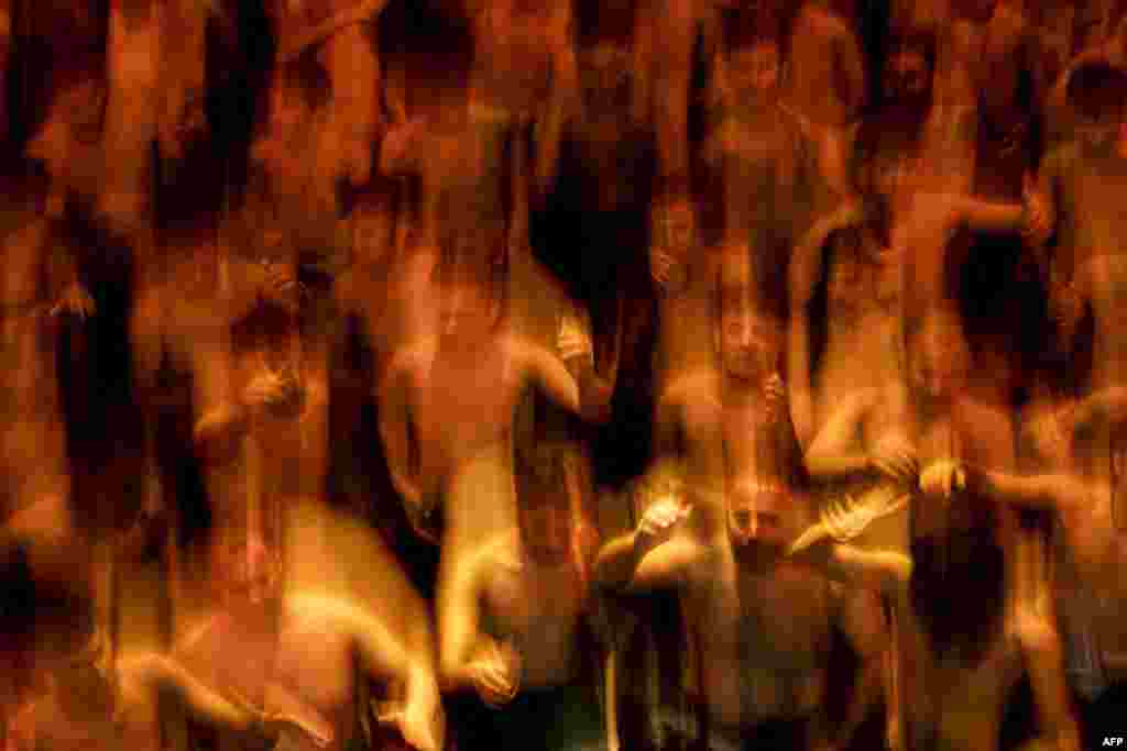 In this long exposure, Shiite Muslims take part in a mourning ritual in Iraq's southern city of Basra, during the Muslim month of Muharram in the lead-up to Ashura, a 10-day period commemorating the killing of Prophet Mohammed's grandson Imam Hussein in the battle of Karbala in 680.