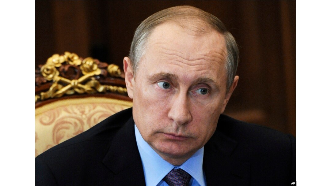 FILE - Russian President Vladimir Putin listens during a meeting in the Kremlin, in Moscow, Russia, July 26, 2016.
