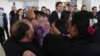 Thai hostage who were freed from Hamas, Bannawat Saethao, second from left, hugs his relatives of upon his arrival at Suvarnabhumi International Airport, in Samut Prakarn Province, Thailand, Feb. 9, 2025.