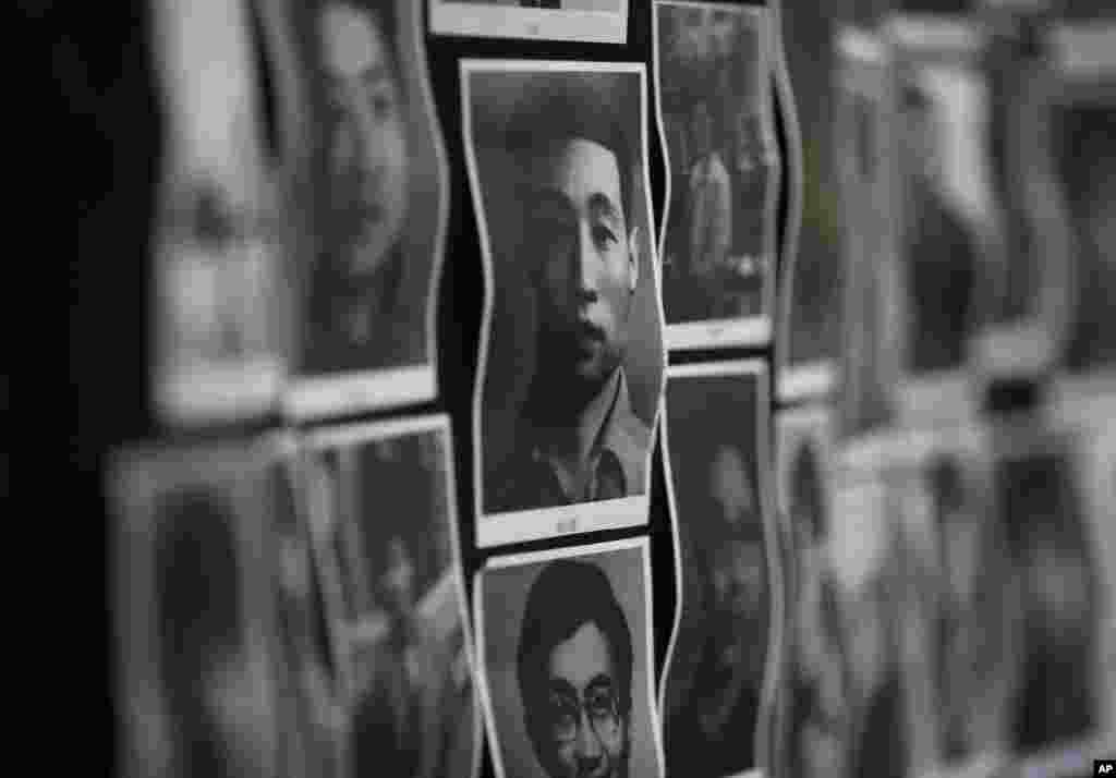 Portraits of victims of the June 4, 1989 bloodshed are displayed at the June 4 Memorial Museum run by pro-democracy activists in Hong Kong Monday, June 4, 2012 to commemorate the 23rd anniversary of the June 4th military crackdown on a pro-democracy stude