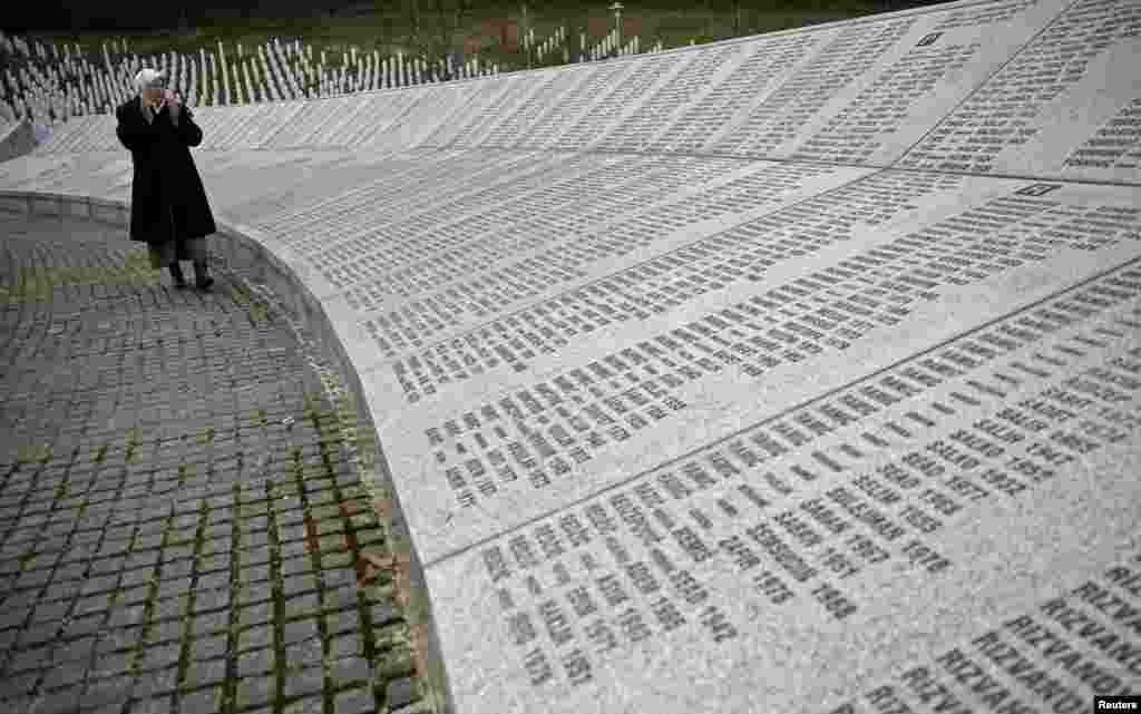 Fadila Efendic prays near memorial plaques at the Potocari genocide memorial center near Srebrenica. Fadila lost her son and husband in the Srebrenica massacre. Serbia arrested eight men suspected of taking part in the 1995 Srebrenica massacre in Bosnia, the first such arrests in the ex-Yugoslav republic of accused gunmen in Europe's worst atrocity since World War II.