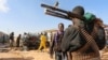 Somali security forces at the scene of a car bombing in Somalia's capital Mogadishu, February 27, 2017. Officials say another bomb killed one person in the capital, Mogadishu, early Tuesday.