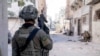 FILE - Israeli soldiers operate in the Gaza Strip on Dec. 14. Israel's Prime Minister Benjamin Netanyahu has said that only the Israel Defense Forces can be trusted to demilitarize Gaza after the war.