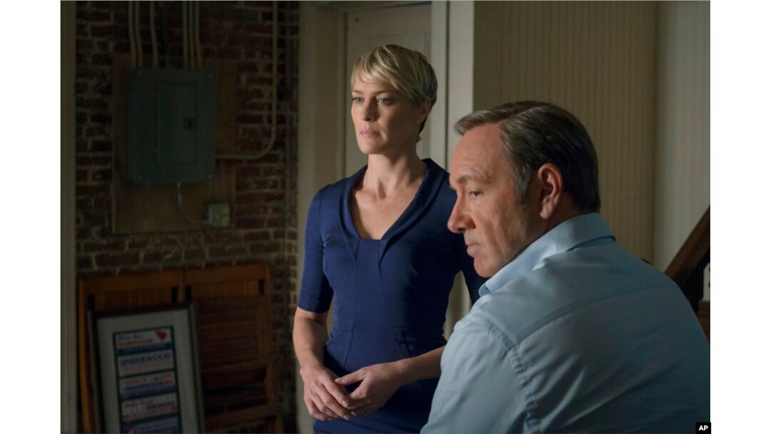 File - This image released by Netflix shows Robin Wright as Clair Underwood, left, and Kevin Spacey as Francis Underwood in a scene from "House of Cards." The second season of the popular original series premieres, Feb. 14, 2014 on Netflix.