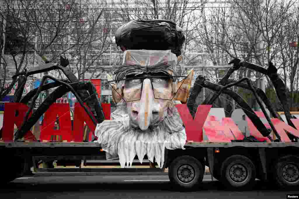A truck with the likeness of Iran's late leader Ayatollah Ruhollah Khomeini is pictured as thousands of Iranian opponents in exile protest against the Teheran regime, days before the 40th anniversary of the Iranian Islamic Revolution, in Paris, France.