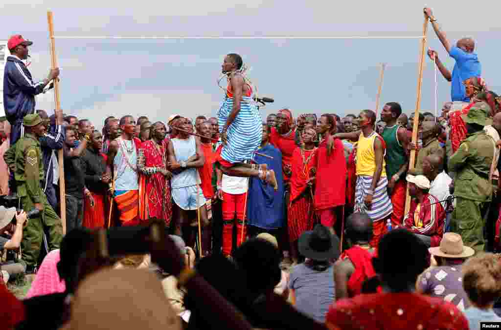 Tipape Lekatoo, a Maasai Moran from Mbirikani Manyatta, competes in a traditional high-jump event during the 2018 Maasai Olympics at the Sidai Oleng Wildlife Sanctuary, at the base of Mt. Kilimanjaro, near the Kenya-Tanzania border in Kimana, Kajiado, Kenya, Dec. 15, 2018.