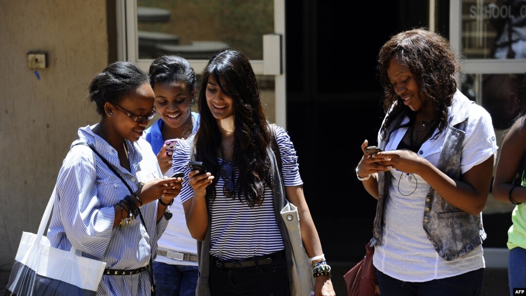 FILE - with the new app on their mobile device, people can receive and share information in real-time in the event of a health crisis, epidemic(s), and natural disasters.