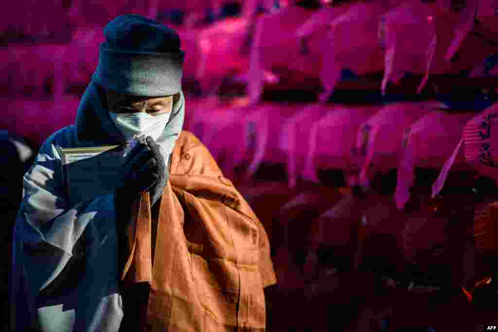 A monk from the Jogye Order, the largest Buddhist sect in South Korea, prays as he attends a mass rally of 5,000 Buddhists to protest alleged religious bias by South Korean President Moon Jae-in's administration, at the Jogye temple in Seoul.