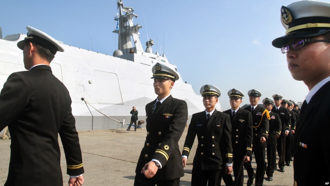 FILE - Taiwan navy sailors and officers at Suao port in Yilan county, northeast of Taiwan, Dec. 23, 2014.