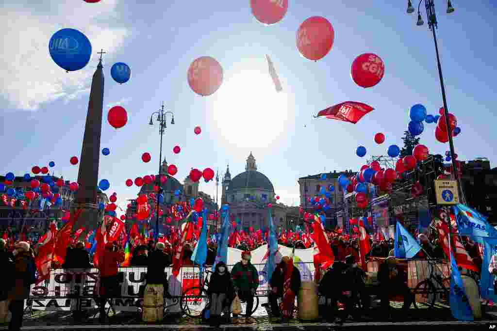 Thousands gather in Rome's central Piazza del Popolo during a nationwide strike called by the main unions to protest a government's proposed budgetary law.