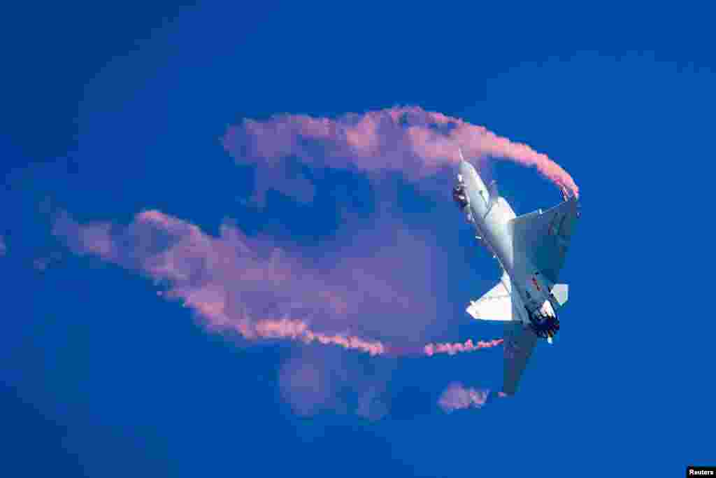 A J-10B fighter jet of Chinese People's Liberation Army Air Force (PLAAF) performs during the China International Aviation and Aerospace Exhibition, or Zhuhai Airshow in Zhuhai, Guangdong province.