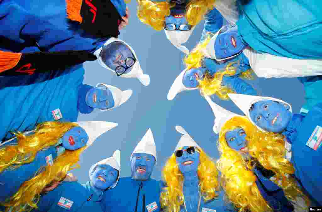 Participants dressed as smurfs pose during an attempt to hold the world's largest meeting of smurfs in Lauchringen, Germany, Feb. 16, 2019.