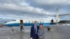 Chinese American academic Xiyue Wang, released by Iran after three years in jail as part of a prisoner swap with the U.S., stands with U.S. Special Representative for Iran Brian Hook at Zurich airport on December 7, 2019.