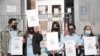 A group of Thai demonstrator holds the portraits of late Vicha Ratanapakdee, during a rally to raise awareness of anti-Asian violence outside the Hall of Justice, SF, March 4, 2021