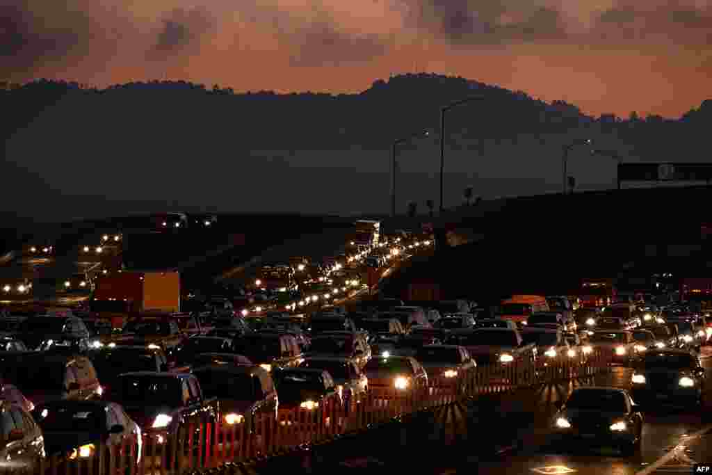 Traffic backs up at the San Francisco-Oakland Bay Bridge toll plaza as commuters make their way into San Francisco on the first day of the (Bay Area Rapid Transit) BART strike in Oakland, California.