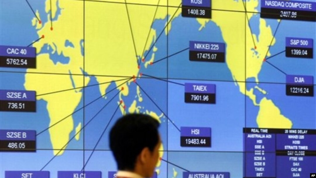FILE - Screen shows world indexes at the Hong Kong Stock Exchange.
