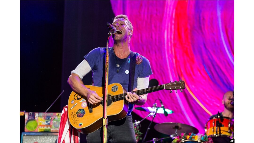 FILE - Chris Martin of Coldplay performs at The Budweiser Made In America Festival in Philadelphia.