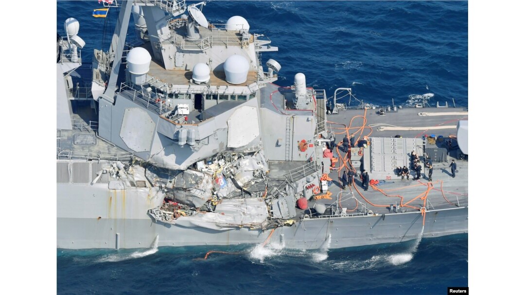 The Arleigh Burke-class guided-missile destroyer USS Fitzgerald, damaged by colliding with a Philippine-flagged merchant vessel, is seen off Shimoda, Japan, June 17, 2017, in this photo taken by Kyodo.