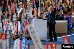 Former President Bill Clinton waves as he takes the stage at the Democratic National Convention in Philadelphia, July 26, 2016.