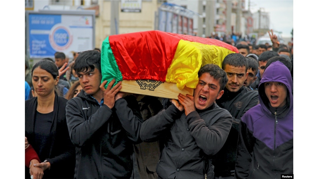 Mourners carry coffin of Yakup Sinbag, a civilian who was killed during the clashes between Turkish security forces and Kurdish militants, in Silvan in the southeastern Diyarbakir province, Turkey, Nov. 10, 2015.