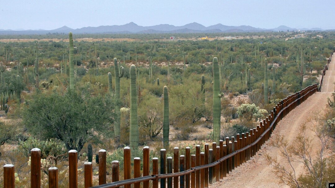 FILE - The international border line made up of bollards separating Mexico, left from the United States, in the Organ Pipe National Monument near Lukeville, Ariz., Feb. 17, 2006.
