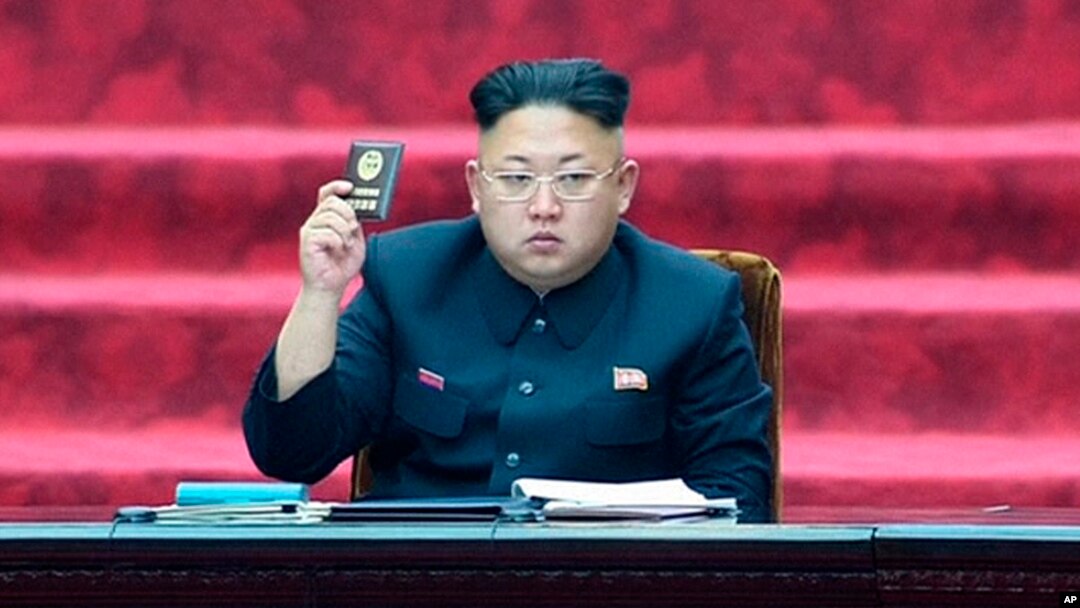 FILE - In this April 9, 2014, image made from video, North Korean leader Kim Jong Un holds up parliament membership certificate during the Supreme People's Assembly in Pyongyang, North Korea.
