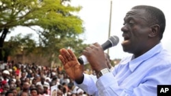 Uganda's main opposition leader and Inter Party flag bearer, Dr. Kiiza Besigye, addresses his supporters at Masaka Lyantonde, about 200 kms west of Kampala capital Uganda. Saturday, Nov. 6, 2010