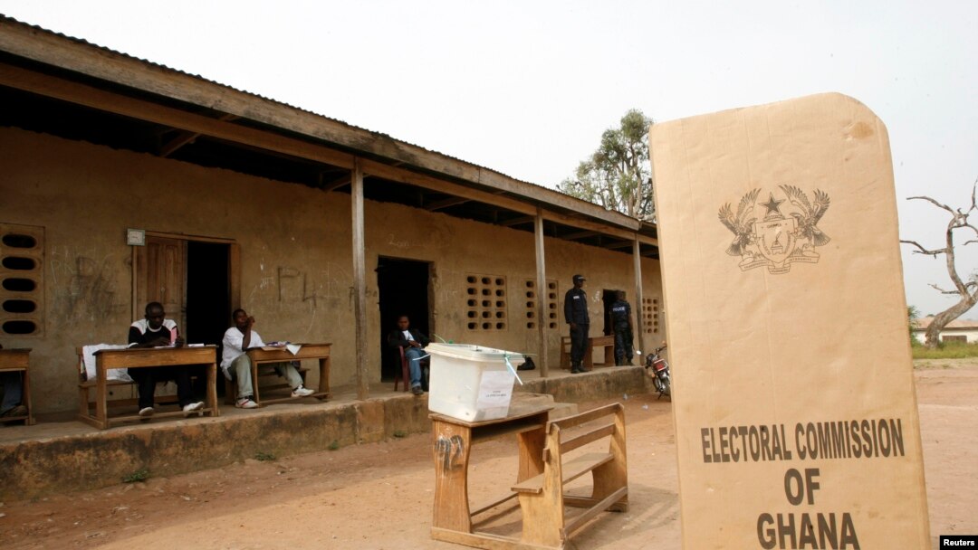 FILE - A sign for Ghana's Electoral Commission is seen at a polling station in Accra, Jan. 2, 2009.