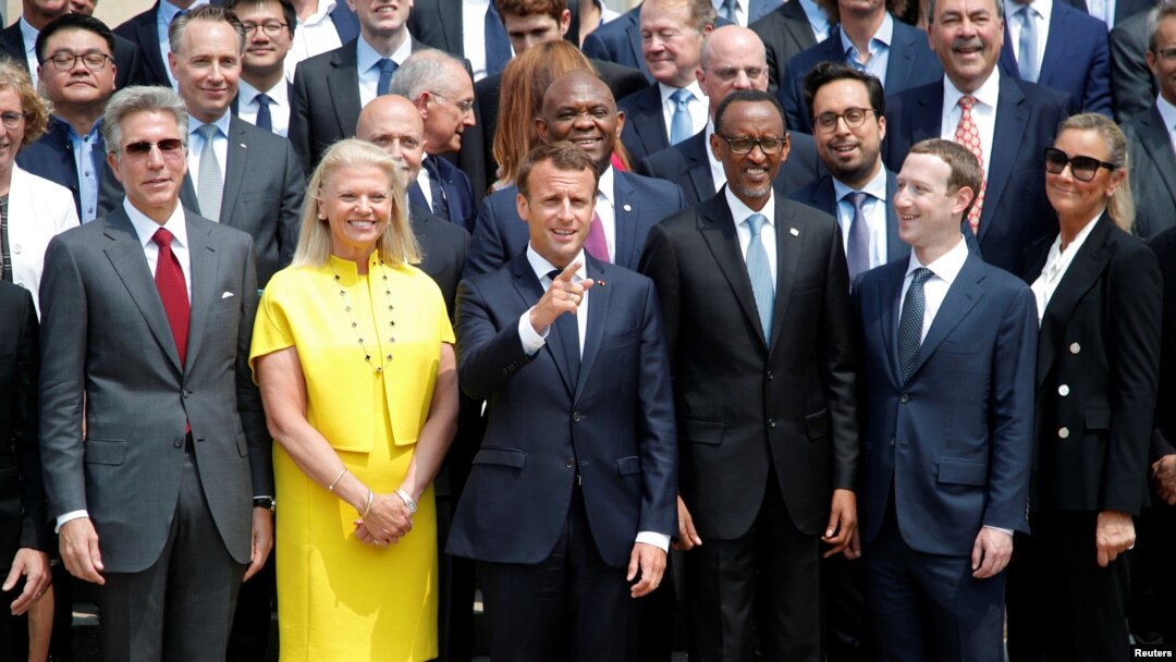 French President Macron poses for a family picture with Rwanda's President Kagame, Facebook's CEO Mark Zuckerberg and IMB's CEO Virginia Rometty at the Elysee Palace in Paris, May 23, 2018.