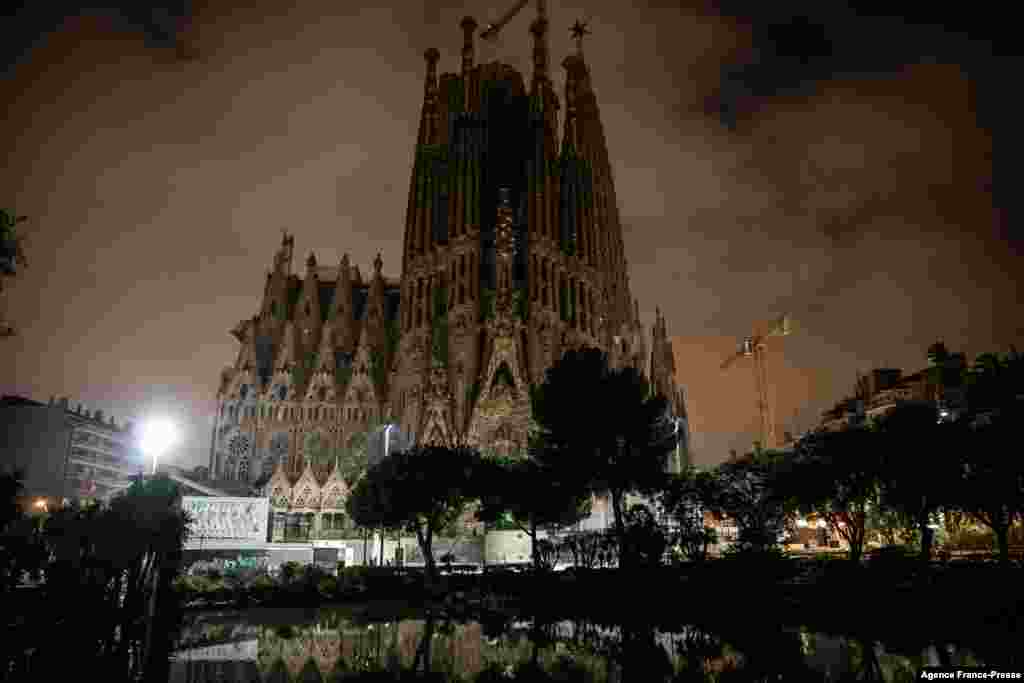 The Sagrada Familia basilica in Barcelona, on the night of December 23 to December 24, 2021, as Spain's Catalonia reimposes a night-time curfew, closes nightclubs and limits social gatherings to fight a record surge in Covid-19 infections.