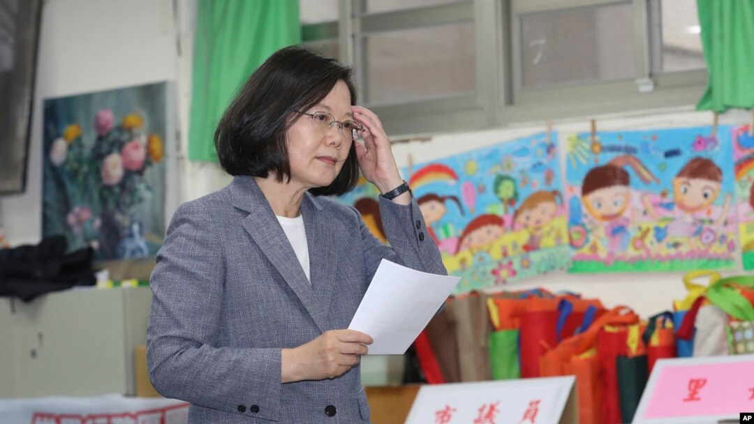 Taiwanese President Tsai Ing-wen waits to cast her ballot at a polling station, Saturday, Nov. 24, 2018, in Taipei, Taiwan. 