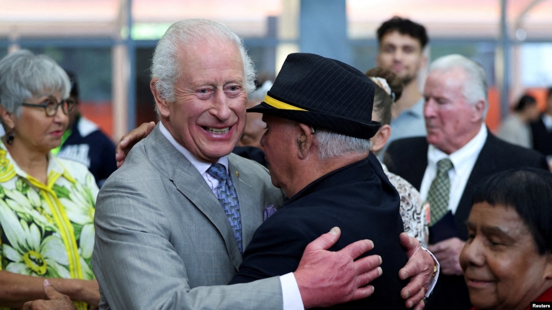 Britain's King Charles embraces Uncle James 'Michael' Widdy Welsh, a member of the Indigenous community, during a visit to the National Centre of Indigenous Excellence in Sydney, Australia, October 22, 2024.